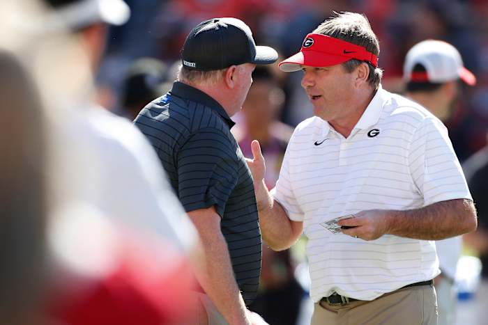 Georgia coach Kirby Smart speaks with Kentucky coach Mark Stoops before an NCAA college football game between Kentucky and Georgia in Athens, Ga., on Saturday, Oct. 16, 2021. News Joshua L Jones